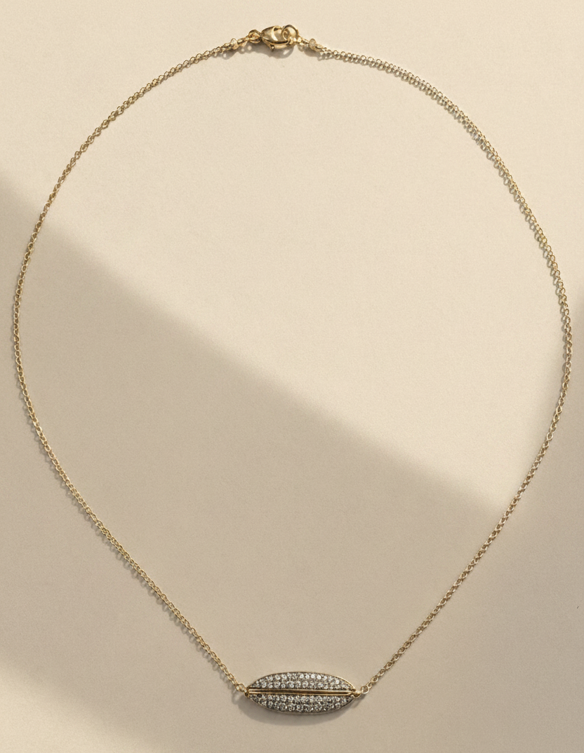 Gold necklace with pavé diamond ellipse pendant