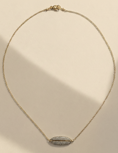 Gold necklace with pavé diamond ellipse pendant