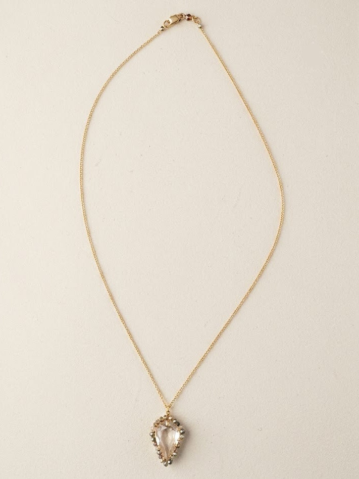 Gold-tone thin chain necklace with small heart teardrop pendant and clear stones