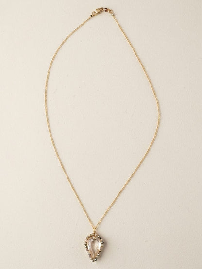 Gold-tone thin chain necklace with small heart teardrop pendant and clear stones