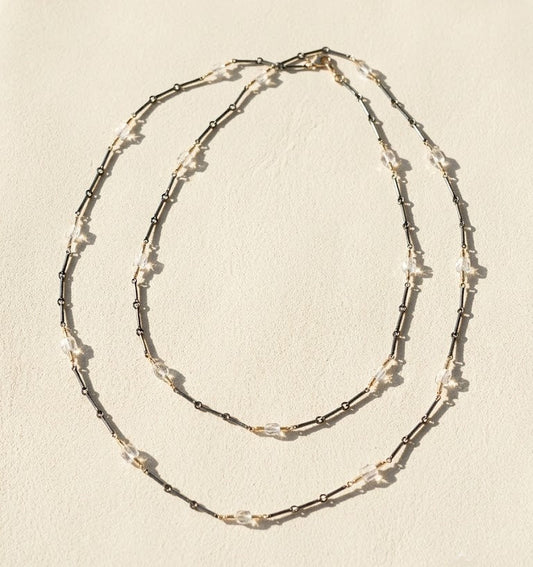 Long two-tone crystal chain necklace with layered double rows of crystal and dark links