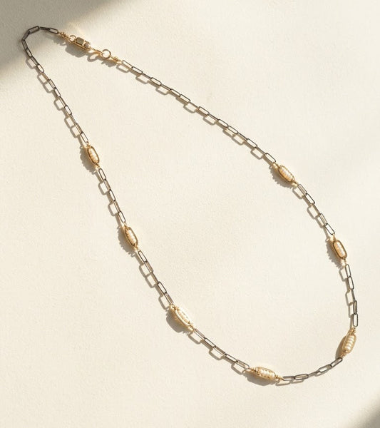 Two-tone seed pearl necklace with oval bead stations on linked metal chain