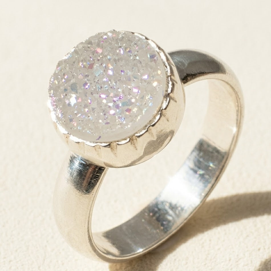 Small round druzy ring with white sparkling stone in silver bezel