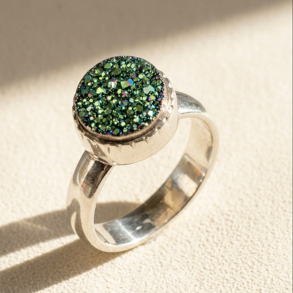 Small round druzy ring with green glitter stone set in silver bezel