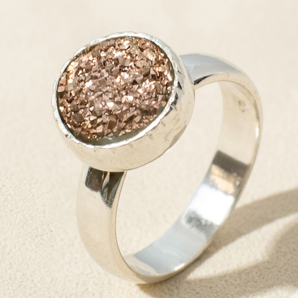 Small round druzy ring with rose-copper sparkly stone in silver bezel