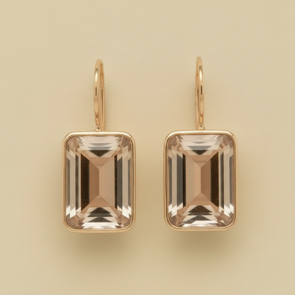 Gold-tone emerald-cut earrings with large champagne square crystals and small hoop backs
