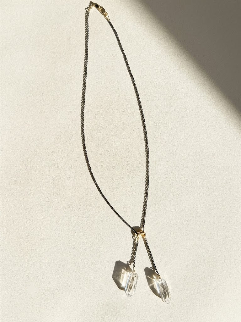 Two-tone crystal quartz lariat necklace with two faceted crystal drops