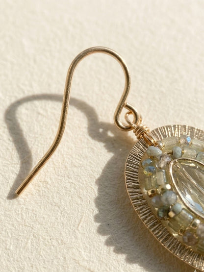 Gold-tone drop earring hook with oval beaded frame and clear center stone