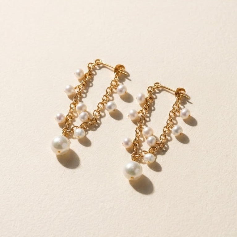 Gold pearl cluster hoop earrings with dangling white bead strands