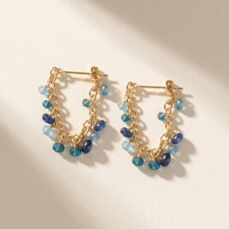 Gold chain hoop earrings with mixed blue and teal bead drops
