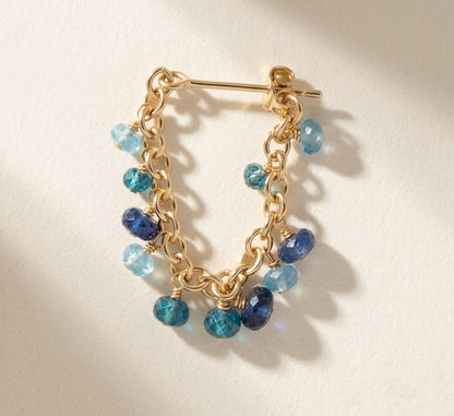 Gold chain hoop earrings with assorted blue bead charms and hinged posts