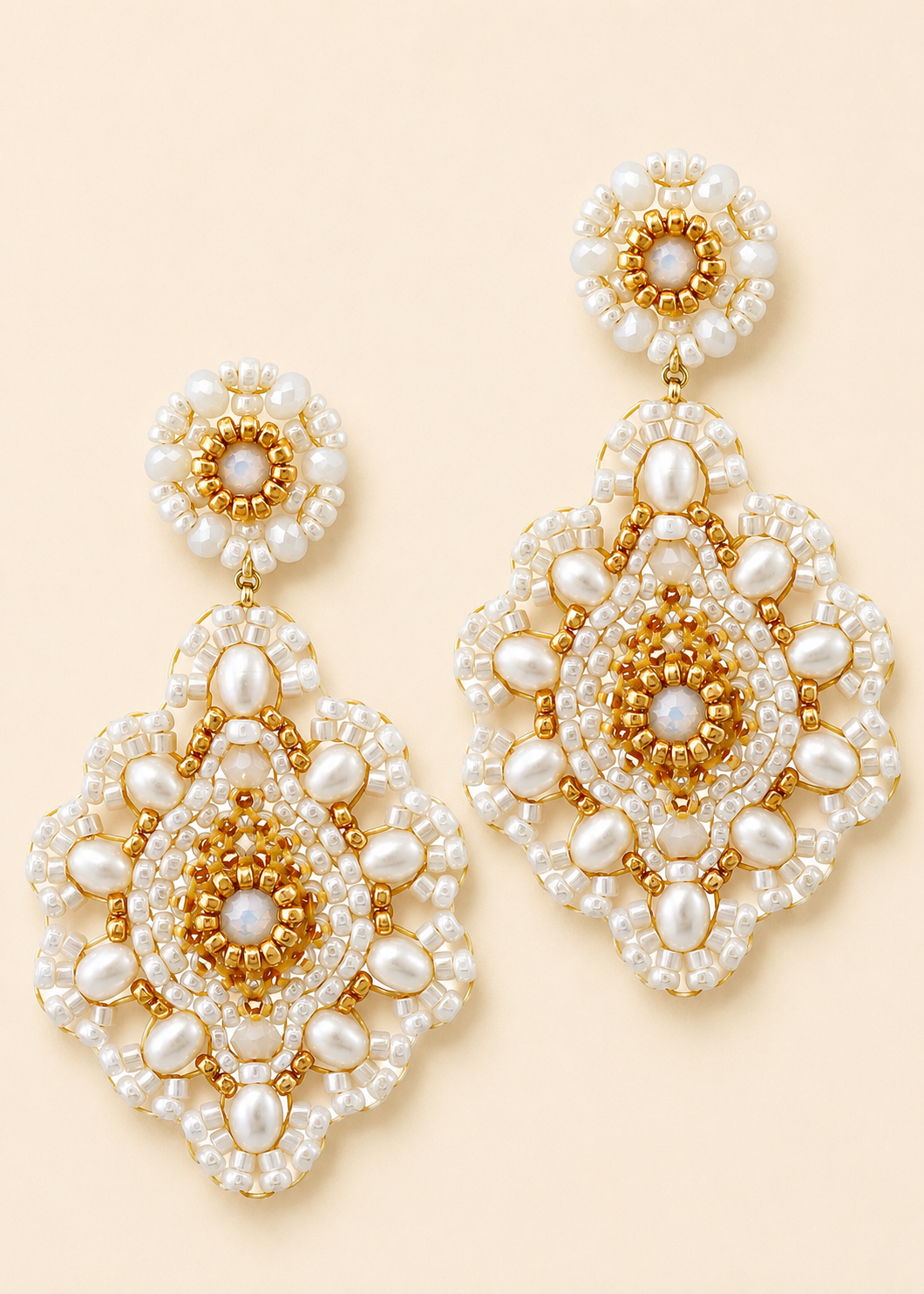 Large beaded teardrop earrings with white pearl drops and gold accents