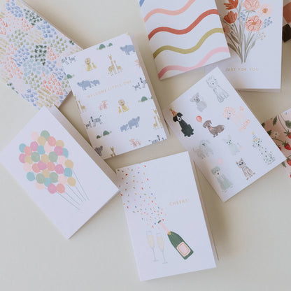 Mini greeting cards assorted designs, including pastel balloon cluster illustration