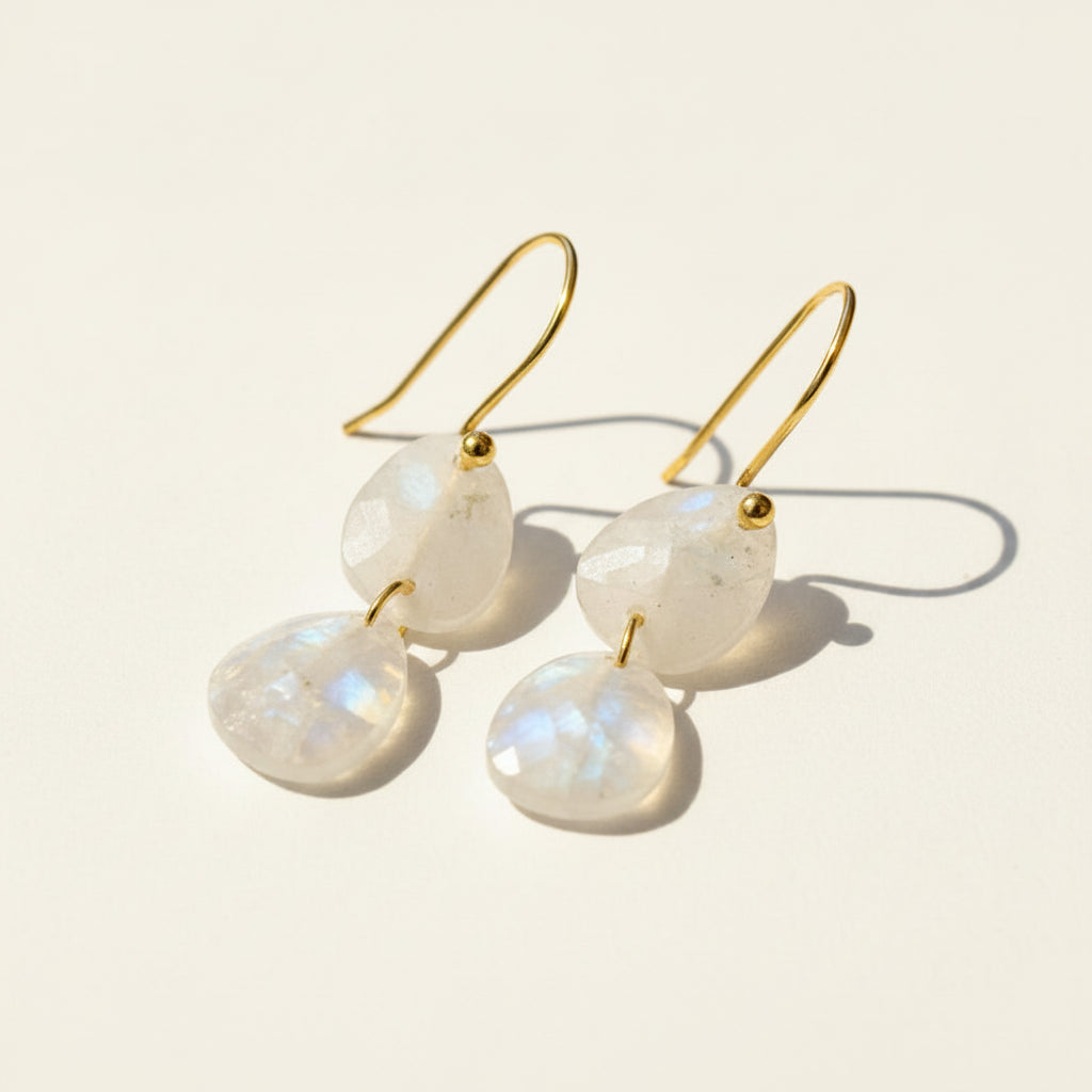 Gold-tone drop earrings with moonstone double teardrop stones on hooks