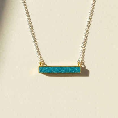 Two-tone druzy bar necklace with aqua blue rectangular pendant on gold chain