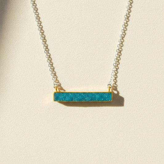 Two-tone druzy bar necklace with aqua blue rectangular pendant on gold chain