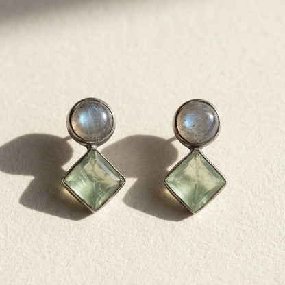 Double stone stud earrings with round gray and square pale green stones