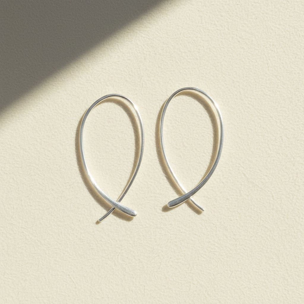 Silver-tone endless loop hoop earrings with curled hook ends