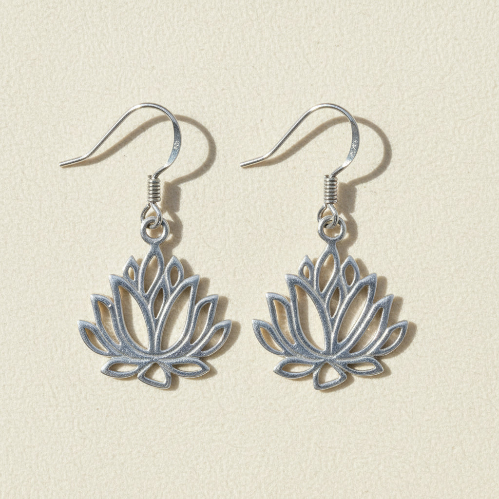 Silver-tone drop earrings with blue lotus flower charms and hook backs.