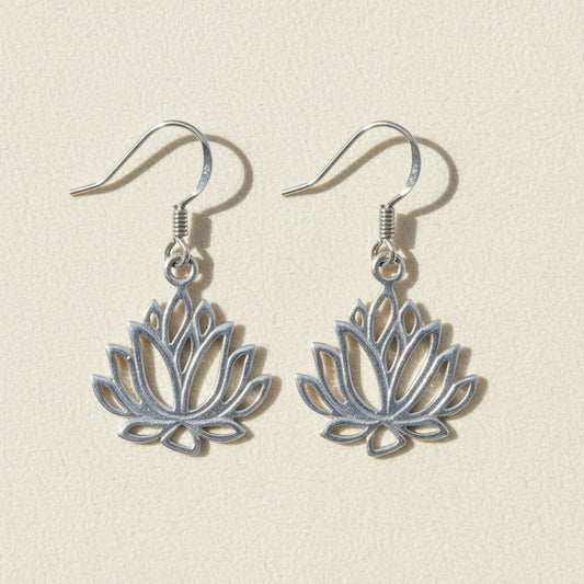 Silver-tone drop earrings with blue lotus flower charms and hook backs.