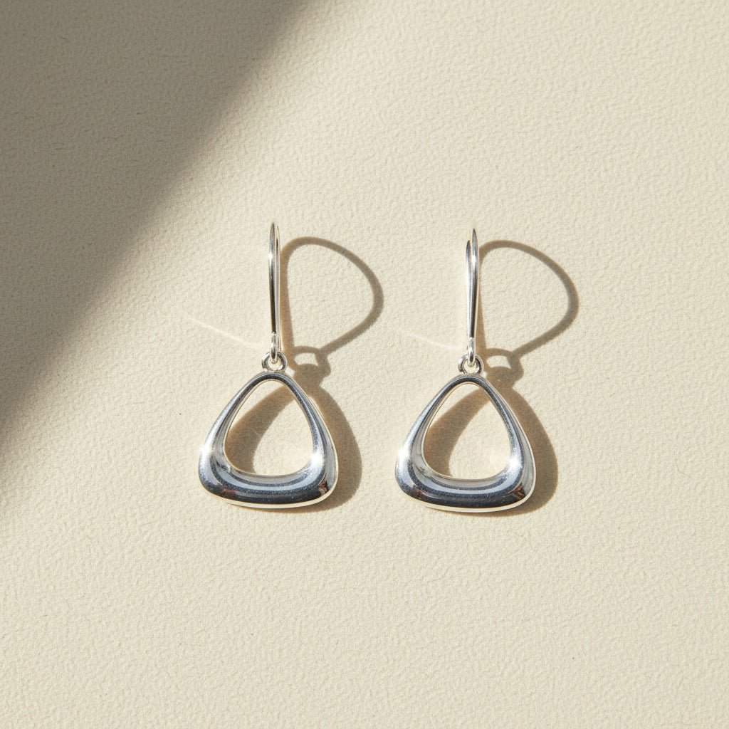 Silver puffy triangle drop earrings with fishhook backs