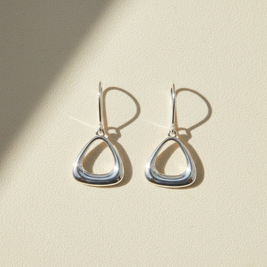 Silver puffy triangle drop earrings with fishhook backs