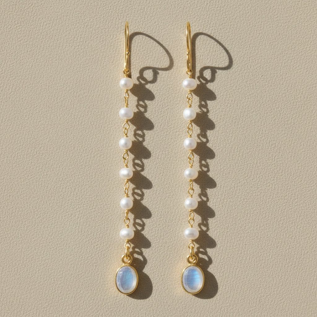 Gold-tone moonstone and pearl dangle earrings with oval blue drop and layered pearls