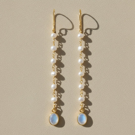 Gold-tone moonstone and pearl dangle earrings with oval blue drop and layered pearls