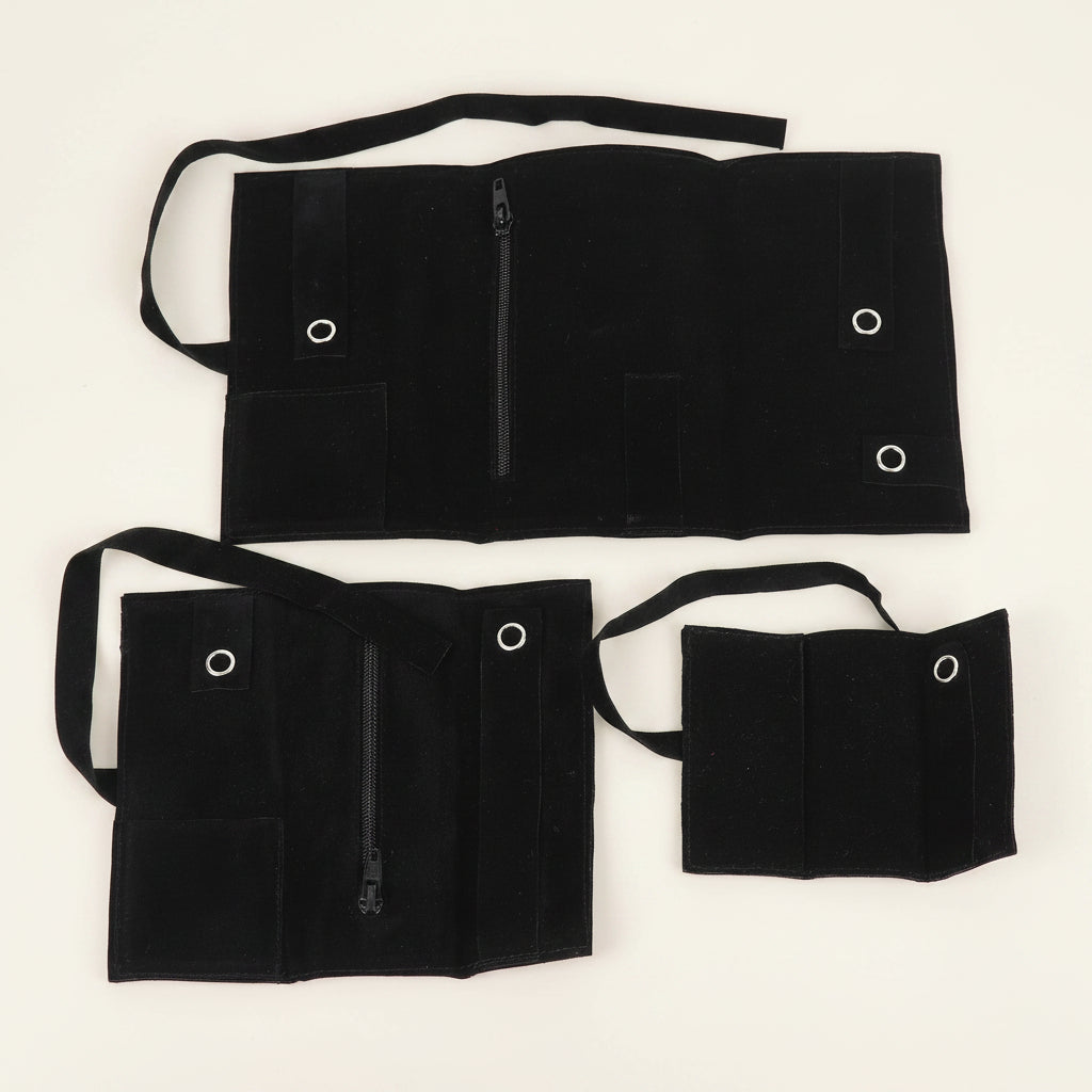 Black fabric bags with straps on a white background