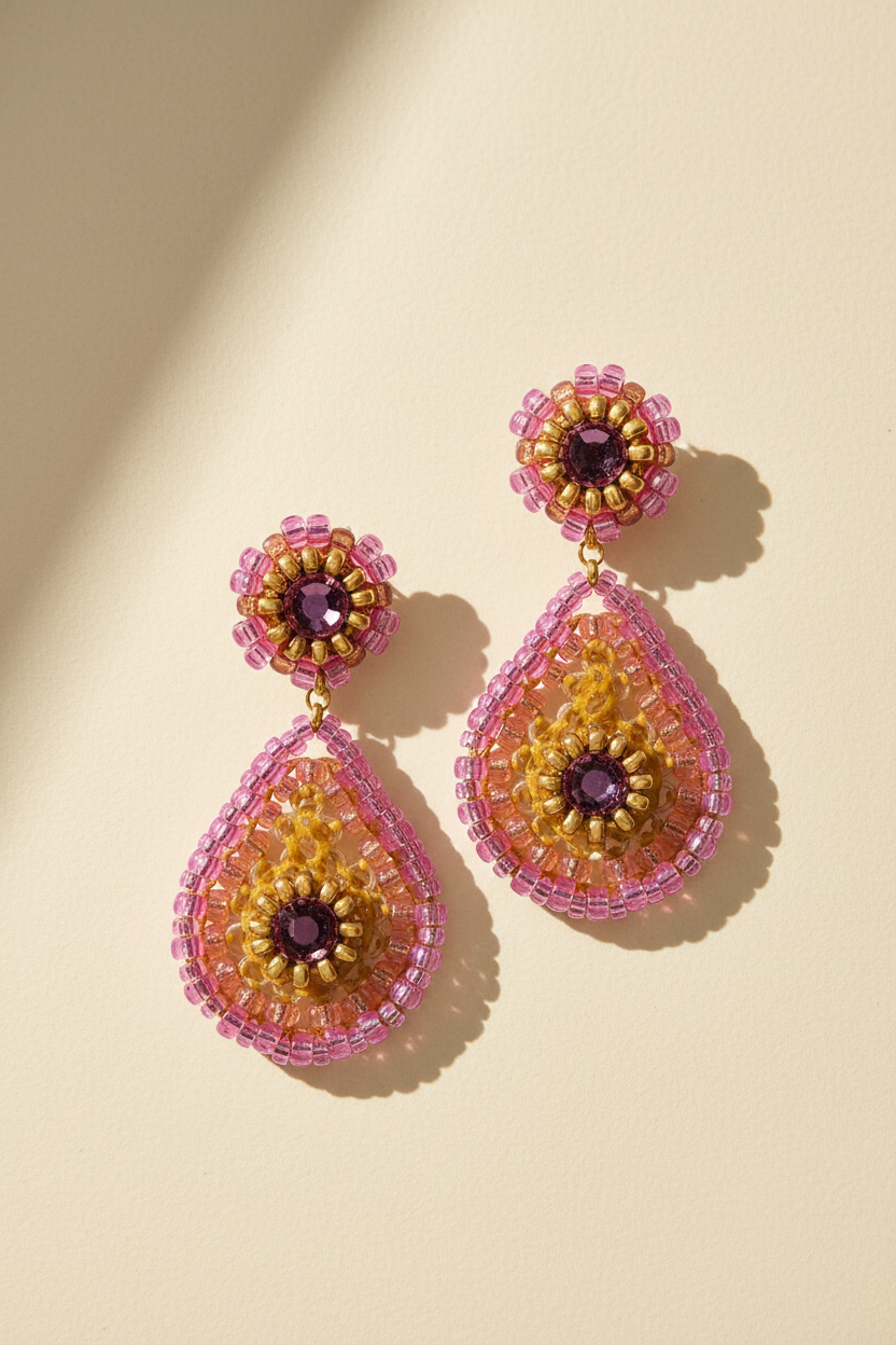 Bright pink beaded teardrop post earrings with round center and dangling teardrop
