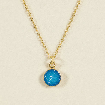 Gold chain druzy pendant necklace with round aqua blue stone