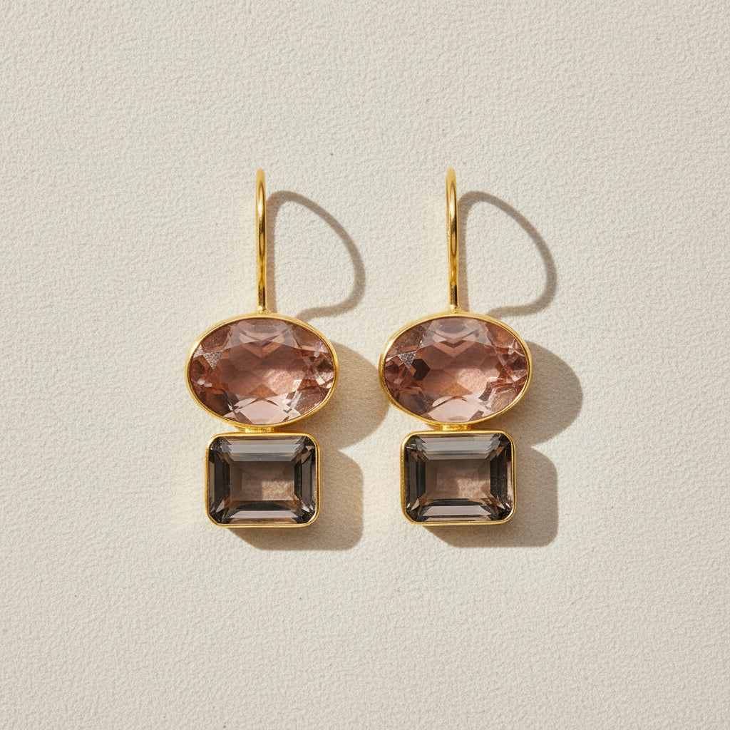 Gold-tone double drop earrings with peach oval top and dark smoky baguette stones