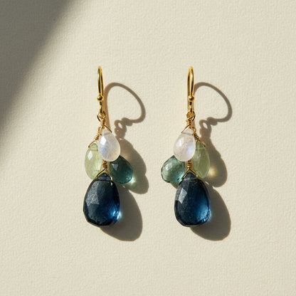 Cluster drop earrings with gold hooks and layered blue, green, and clear beads