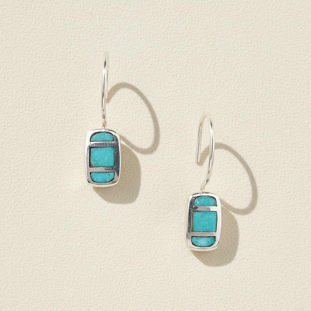 Turquoise rectangular drop earrings with silver-tone bezel and fishhook backs