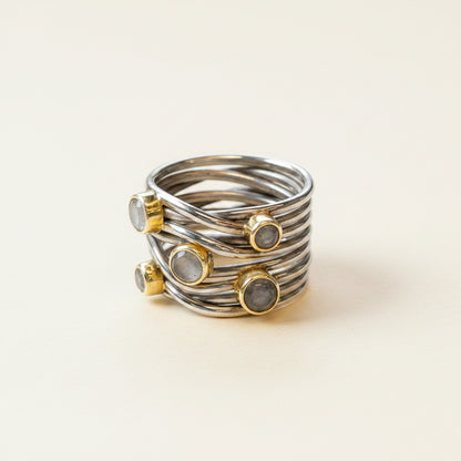 Gunmetal tone sterling statement ring with spiral wire bands and bezel-set round stones