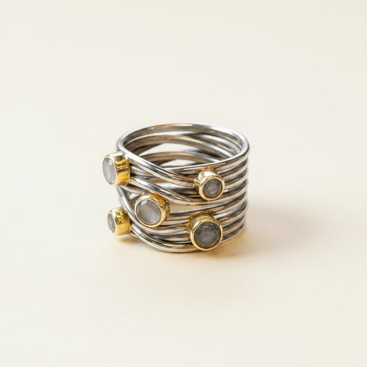 Gunmetal tone sterling statement ring with spiral wire bands and bezel-set round stones