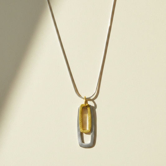 Two-tone rectangular pendant necklace: gold and silver double rectangle links