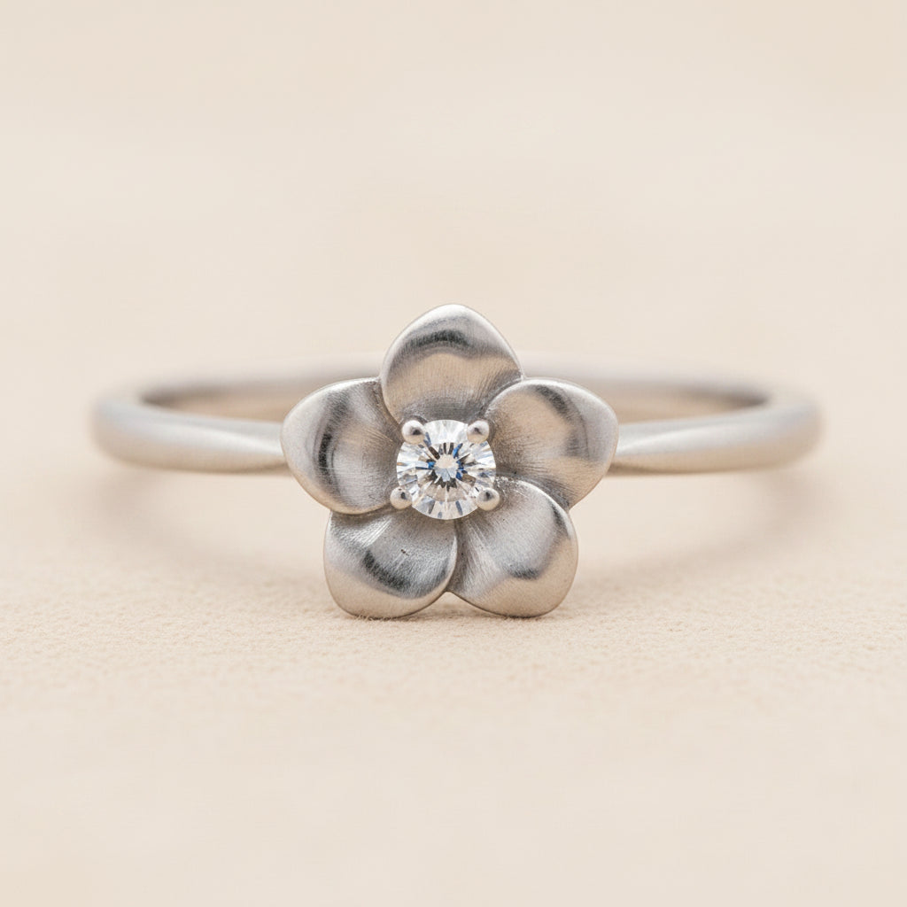 Flower ring with silver-tone band, four-petal flower and round crystal center