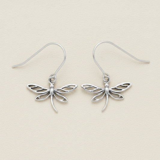 Silver dragonfly dangle earrings with delicate openwork wings and curved hooks.