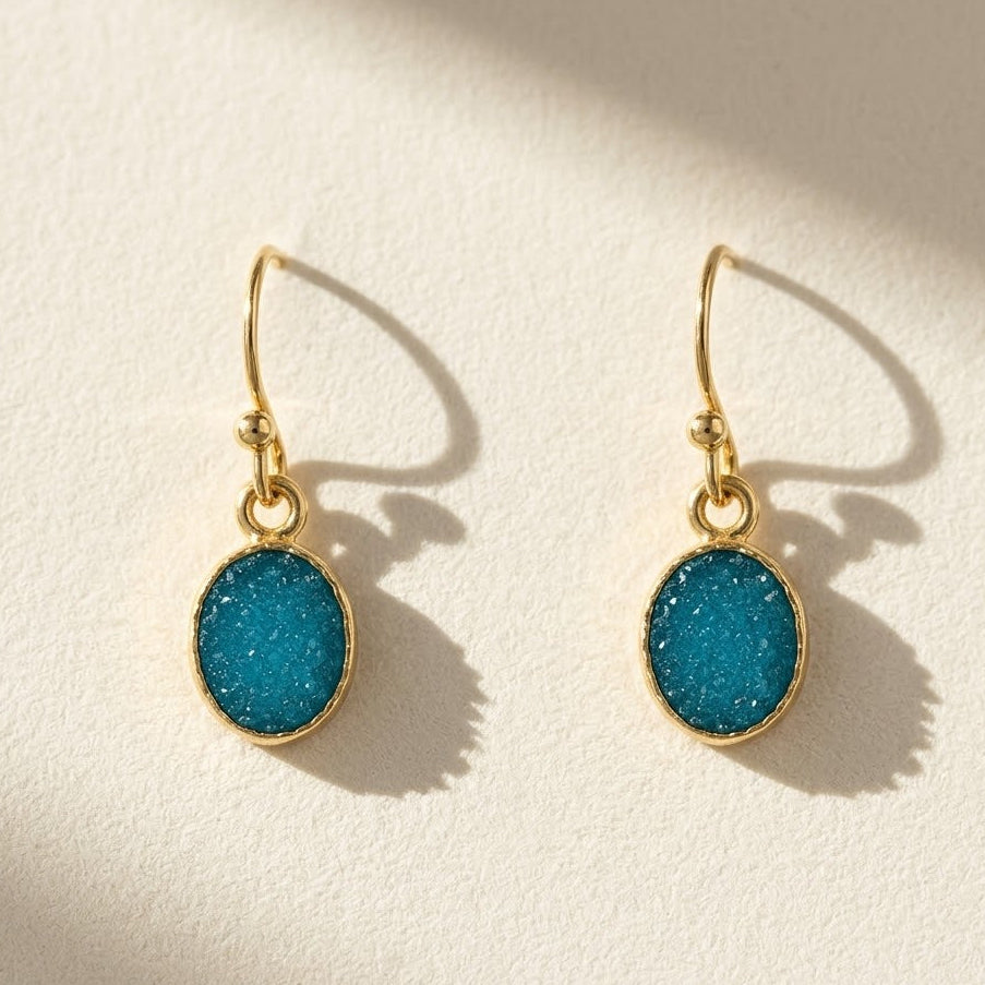 Oval aqua druzy drop earrings with gold-tone hooks and small round rings