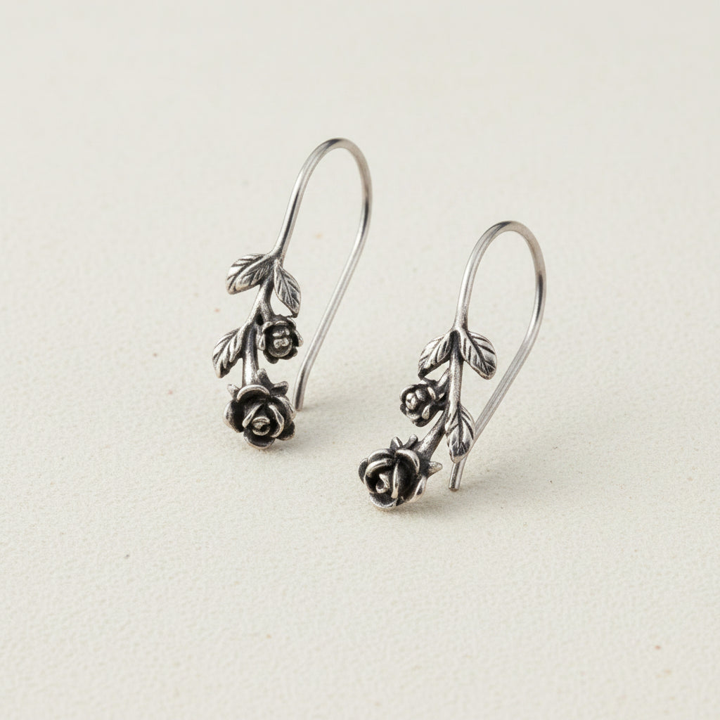 Silver-tone rose drop earrings with dangling rose and leaf charms