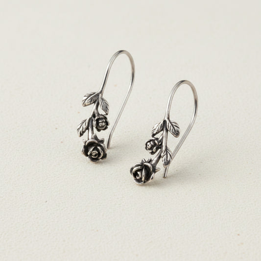 Silver-tone rose drop earrings with dangling rose and leaf charms
