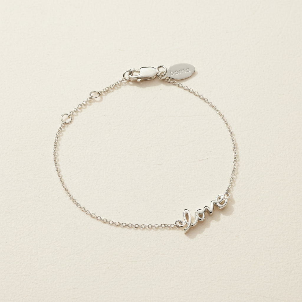 Sterling silver script love bracelet with adjustable clasp and small love charm