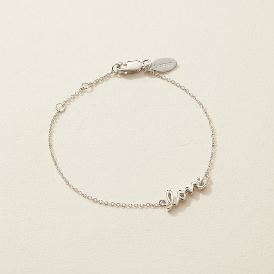 Sterling silver script love bracelet with adjustable clasp and small love charm