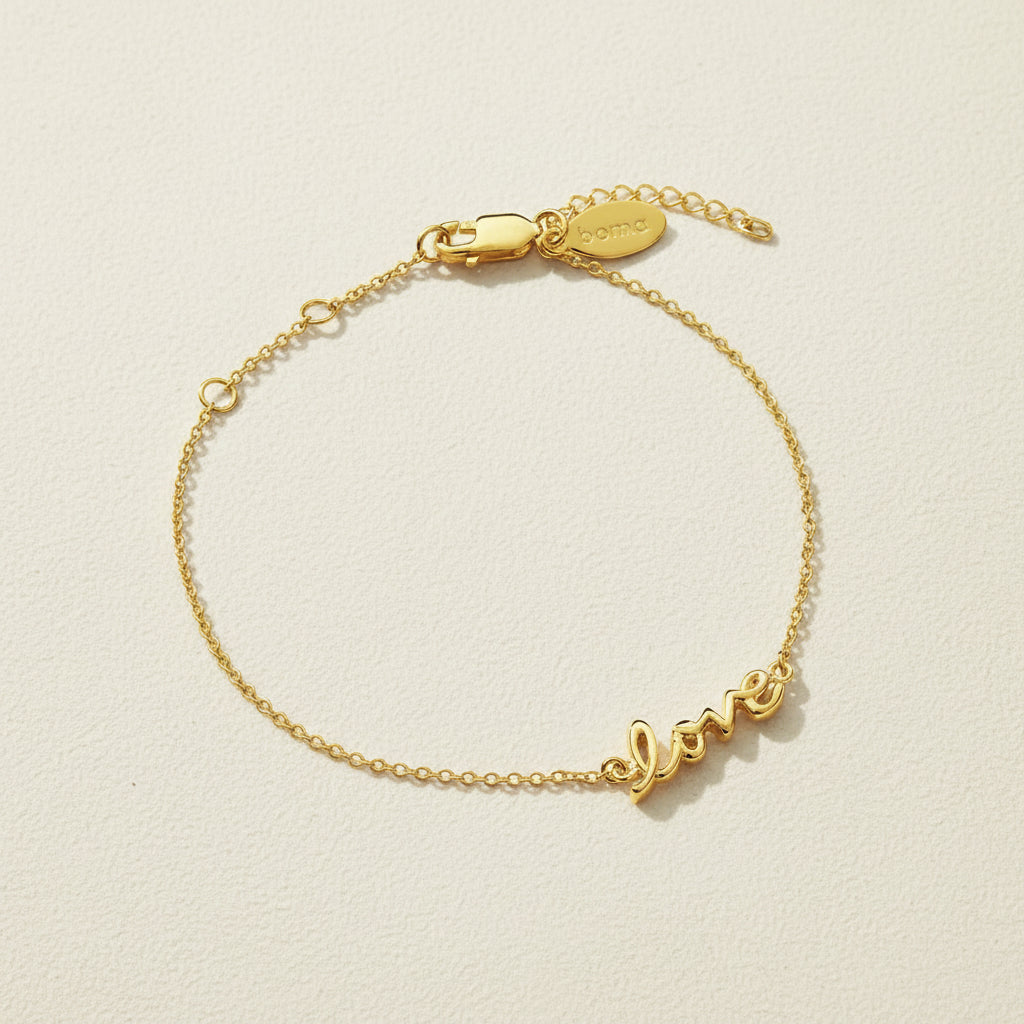 Gold vermeil script love bracelet with adjustable clasp and love charm tag