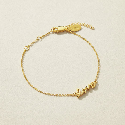 Gold vermeil script love bracelet with adjustable clasp and love charm tag