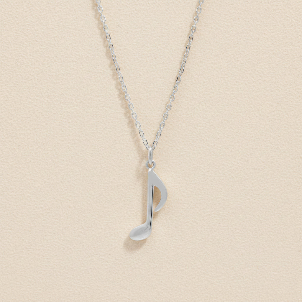 Silver-tone chain necklace with quarter note charm pendant