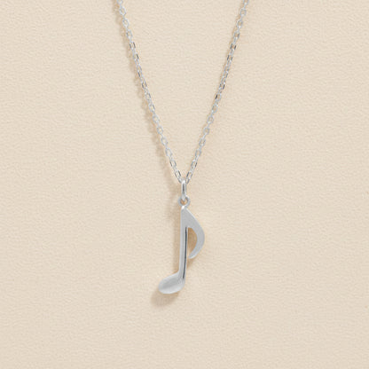 Silver-tone chain necklace with quarter note charm pendant
