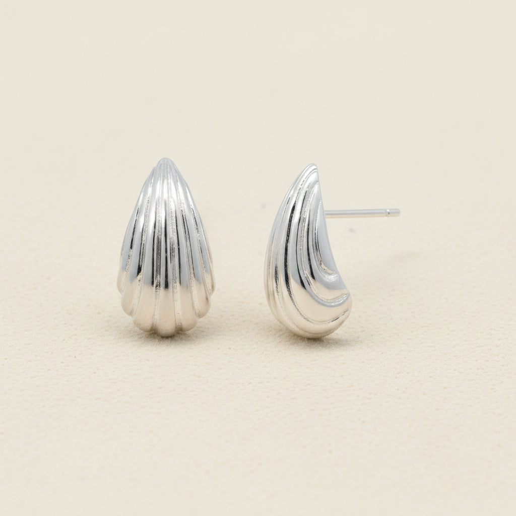 Textured teardrop stud earrings, silver-tone with ridged shell design