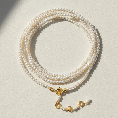 Freshwater pearl wrap bracelet/necklace with gold clasp and layered pearl strands